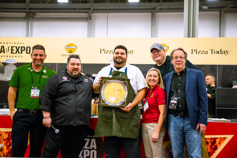 Sergio Balderas, Truly Pizza, Dana Point, California, wins the Traditional Pizza Division at International Pizza Challenge 2024.